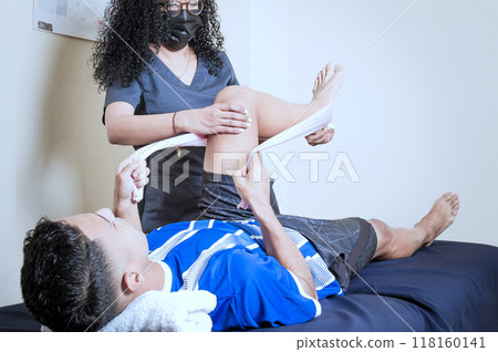 Knee Wrap Physiotherapy, Knee Strengthening Physiotherapy, Neuromuscular Bandage Treatment. Physiotherapy exercises for knee strengthening 118160141