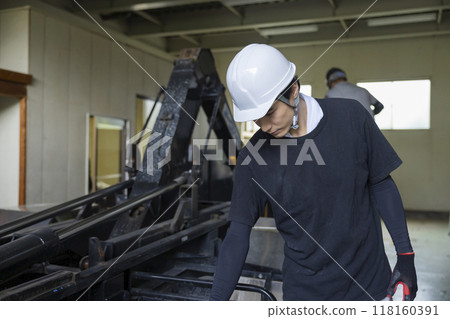 Man inspecting a truck Man inspecting a truck 118160391