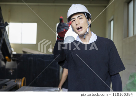 Man inspecting a truck 118160394