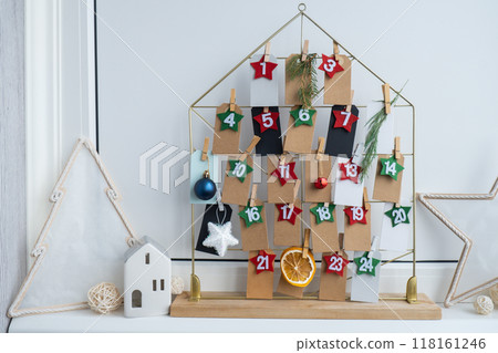 Traditional twenty four days advent calendar before Christmas holidays. Plastic free zero waste sustainable decoration. Winter cozy home Catholic traditions of Christmas countdown new year Traditional twenty four days advent calendar before Christmas holidays. Plastic free zero waste sustainable decoration. Winter cozy home Catholic traditions of Christmas countdown new year 118161246