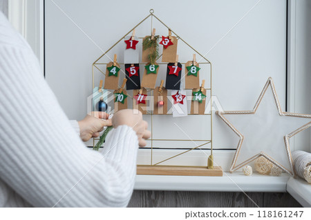 Step by step instruction of making handmade Christmas advent calendar. Creative craft homemade decor. New year celebration. Winter Step by step instruction of making handmade Christmas advent calendar. Creative craft homemade decor. New year celebration. Winter 118161247
