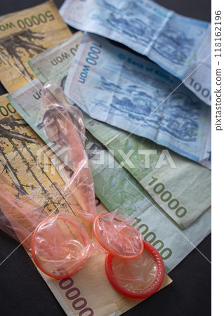 Foreign currency and condoms, earn money, lack of money Foreign currency and condoms, earn money, lack of money 118162196