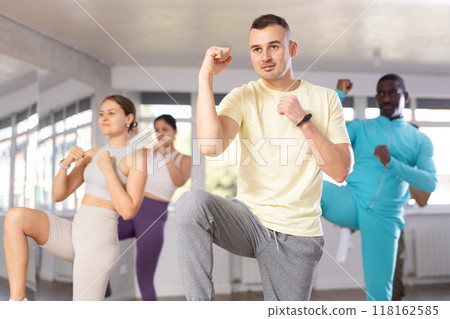 Young Asian man practicing Capoeira dance in training hall 118162585