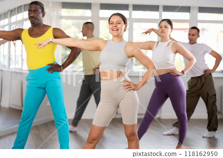 Young woman practicing active dance in training hall 118162950