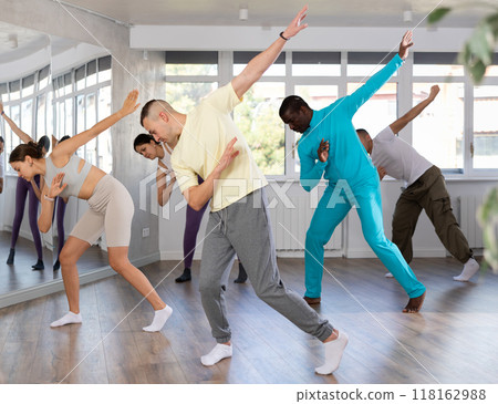 Young man practicing hip-hop dance in training hall Young man practicing hip-hop dance in training hall 118162988