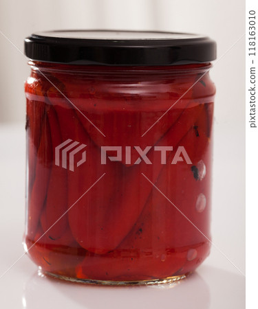 Baked whole sweet peppers in glass jar Baked whole sweet peppers in glass jar 118163010