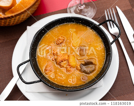 Portion of veal fillet with mushrooms cooked in large amount of fragrant gravy. 118163019