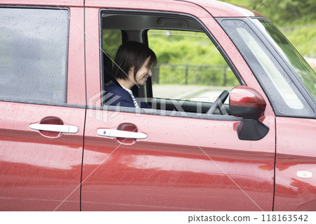 Cute woman driving 118163542