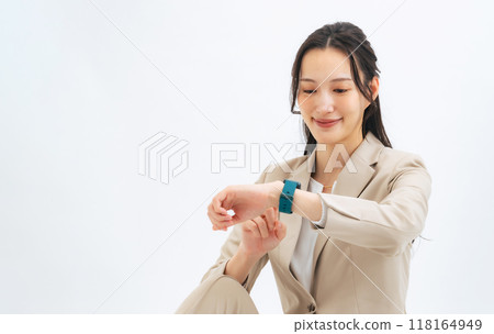 A woman using a smart watch 118164949
