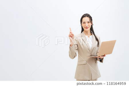 A female business person giving directions with a laptop 118164959