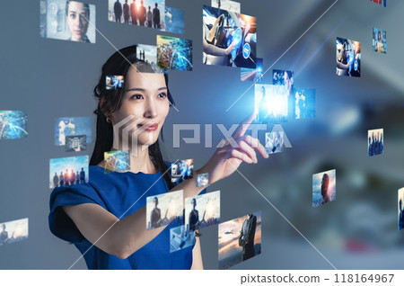 A woman operating a stereoscopic video screen A woman operating a stereoscopic video screen 118164967