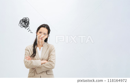 A female business person with a depressed expression A female business person with a depressed expression 118164972