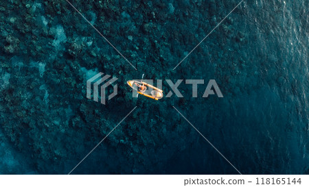 Woman kayaking in sea on transparent kayak. Drone view 118165144