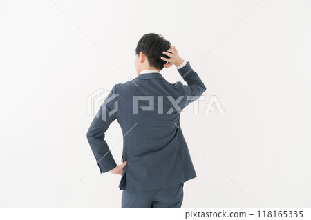 Back view of a worried businessman Back view of a worried businessman 118165335