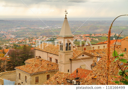 Republic of San Marino in Italy: View of the old town of Borgo Maggiore, a World Heritage Site at the foot of Mount Titano, and the Adriatic Sea Republic of San Marino in Italy: View of the old town of Borgo Maggiore, a World Heritage Site at the foot of Mount Titano, and the Adriatic Sea 118166499