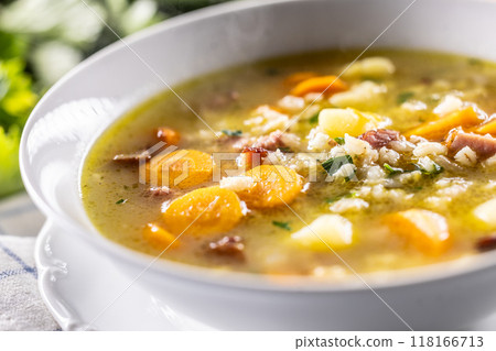 Soup made from barley groats, smoked pork neck, potatoes and root vegetables Soup made from barley groats, smoked pork neck, potatoes and root vegetables 118166713