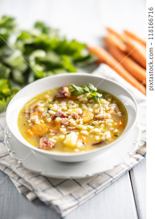 Soup made from barley groats, smoked pork neck, potatoes and root vegetables Soup made from barley groats, smoked pork neck, potatoes and root vegetables 118166716