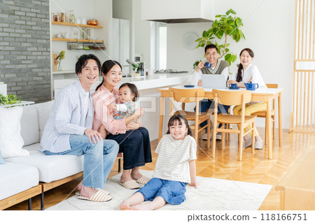 Three-generation family relaxing in the living room 118166751