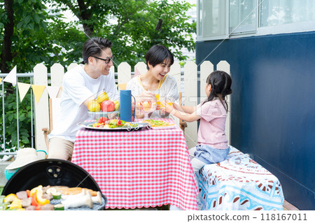 Family enjoying a barbecue Family enjoying a barbecue 118167011