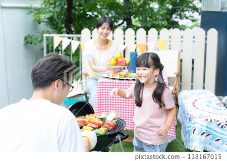Family enjoying a barbecue Family enjoying a barbecue 118167015