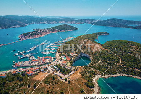 Aerial view of sea landscape with coastal town and yachts. Touristic city for summer vacation among Islands in Adriatic sea. Panoramic view of marina Frapa and Dragon Eye lake in Rogoznica, Croatia Aerial view of sea landscape with coastal town and yachts. Touristic city for summer vacation among Islands in Adriatic sea. Panoramic view of marina Frapa and Dragon Eye lake in Rogoznica, Croatia 118167133
