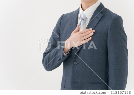 A man in a suit with his hand on his chest A man in a suit with his hand on his chest 118167138