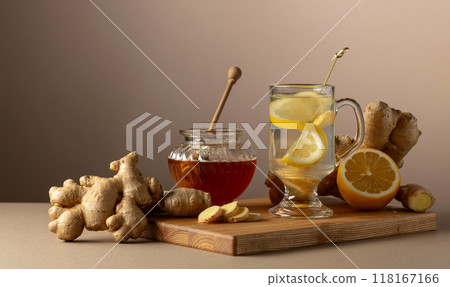 Ginger tea with lemon and honey on a beige background. Ginger tea with lemon and honey on a beige background. 118167166