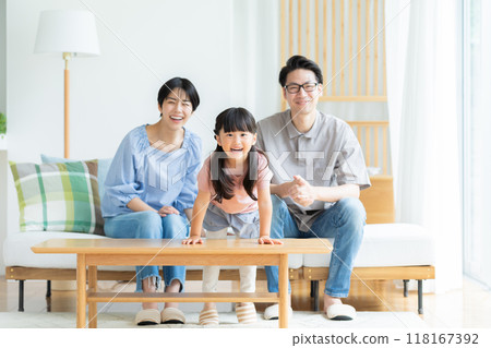 A family relaxing in the living room A family relaxing in the living room 118167392