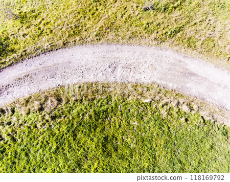 Aerial view of jogging path in nature, dirt running trail. Running training, no people. Aerial view of jogging path in nature, dirt running trail. Running training, no people. 118169792