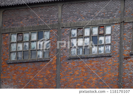 An old and abandoned buildings windows showcasing exquisite rustic brickwork and design An old and abandoned buildings windows showcasing exquisite rustic brickwork and design 118170107