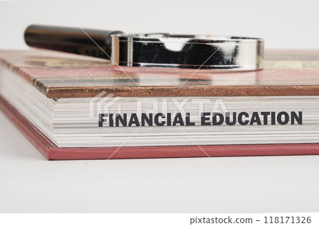 Business Financial education concept. Copy space. Concept words FINANCIAL EDUCATION on the end of the book in close-up 118171326