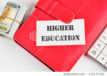 Inscription HIGHER EDUCATION on a business card on a red business book on a white background 118171330
