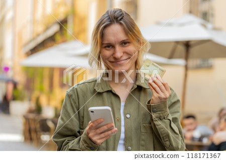 Woman using credit bank card and smartphone while transferring money, purchases online shopping Woman using credit bank card and smartphone while transferring money, purchases online shopping 118171367
