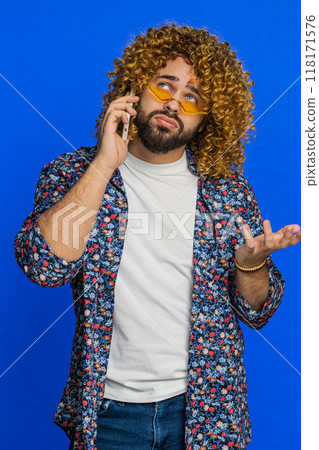 Disinterested tired stylish man having annoyed boring talk on smartphone online conversation quarrel Disinterested tired stylish man having annoyed boring talk on smartphone online conversation quarrel 118171576
