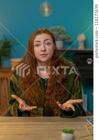 Irritated displeased aggressive unhappy woman gesturing hands blaming scolding for failure problem 118171639