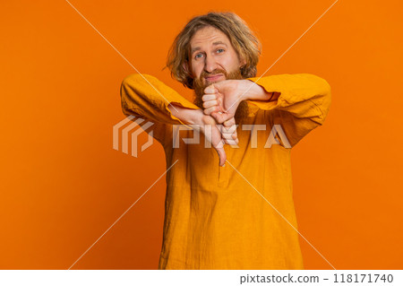 Upset man guy showing thumbs down gesture disapproval dissatisfied dislike negative feedback 118171740