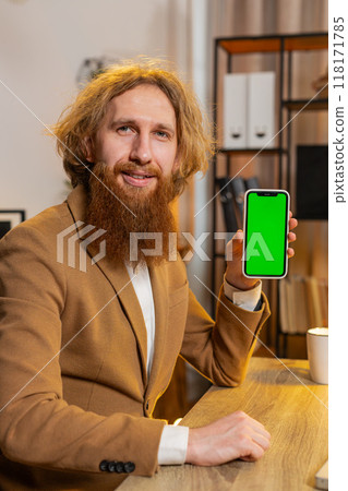 Business man holding smartphone with green screen chroma key mock up recommend good application 118171785