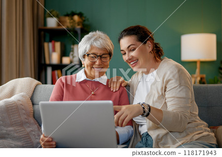 Young and senior women are using laptop Young and senior women are using laptop 118171943
