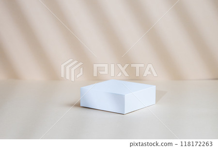 Abstract empty white box with shadows on a beige background. Abstract empty white box with shadows on a beige background. 118172263