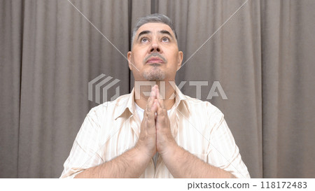 Man Looking Up and Pleading to the Sky 118172483