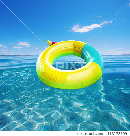 A cheerful yellow pool float drifting in the sparkling blue ocean water under a bright sun 118172799