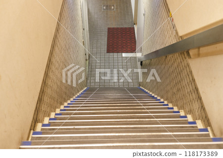 Retro multi-tenant building, stairs leading down to the basement Retro multi-tenant building, stairs leading down to the basement 118173389