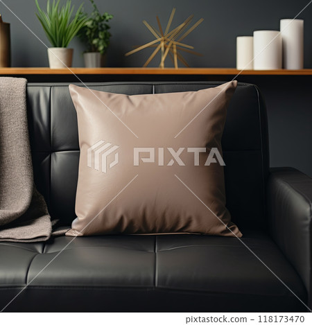 Mockup empty, blank cushion, sitting on a leather sofa, in a living room. 118173470