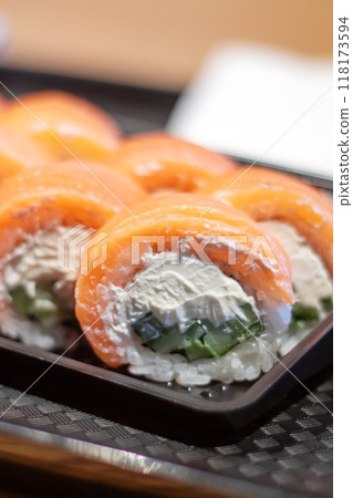A tray of sushi served with ginger and wasabi on the side A tray of sushi served with ginger and wasabi on the side 118173594