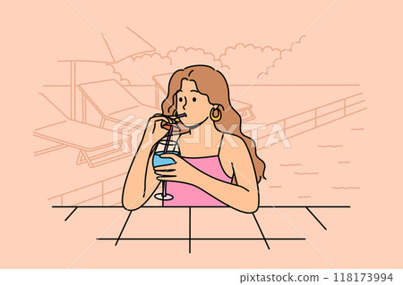 Woman drinks cocktail and swims in pool, enjoying vacation in cool hotel in hot summer weather 118173994