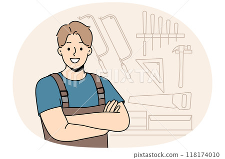 Smiling male carpenter standing in workshop 118174010