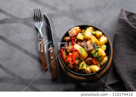 Fried pork meat with potatoes, onions and peppers. National homemade Georgian dish ojakhuri 118174418