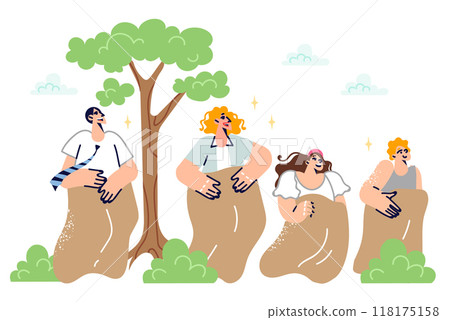 Family participates in sack race together, having fun in their free time in park, in fresh air 118175158