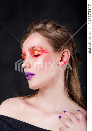 Profile View of Woman with Artistic Makeup Profile View of Woman with Artistic Makeup 118175347