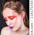 Woman with Eyes Closed and Artistic Makeup 118175350